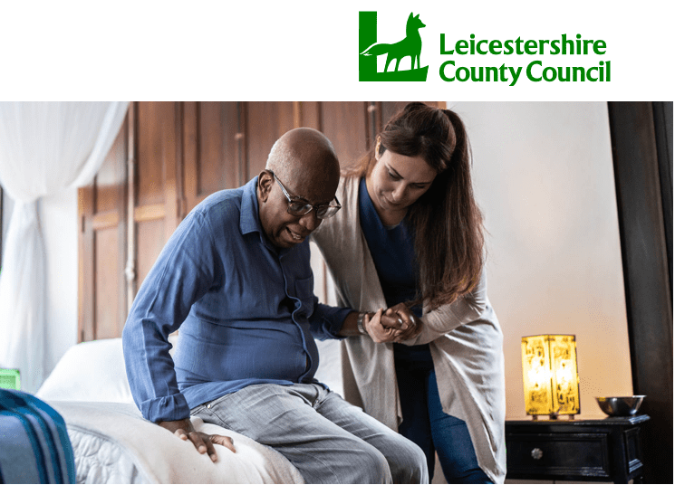 Personal Assistant supporting an individual getting up from their bed with Leicestershire County Council Logo and text